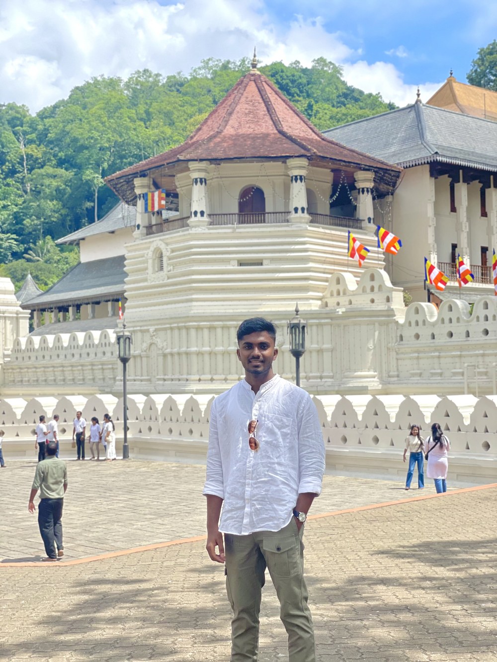 Kaveesha Piyumal, owner of Ceylon Pearlux, standing outside a Sri Lankan temple